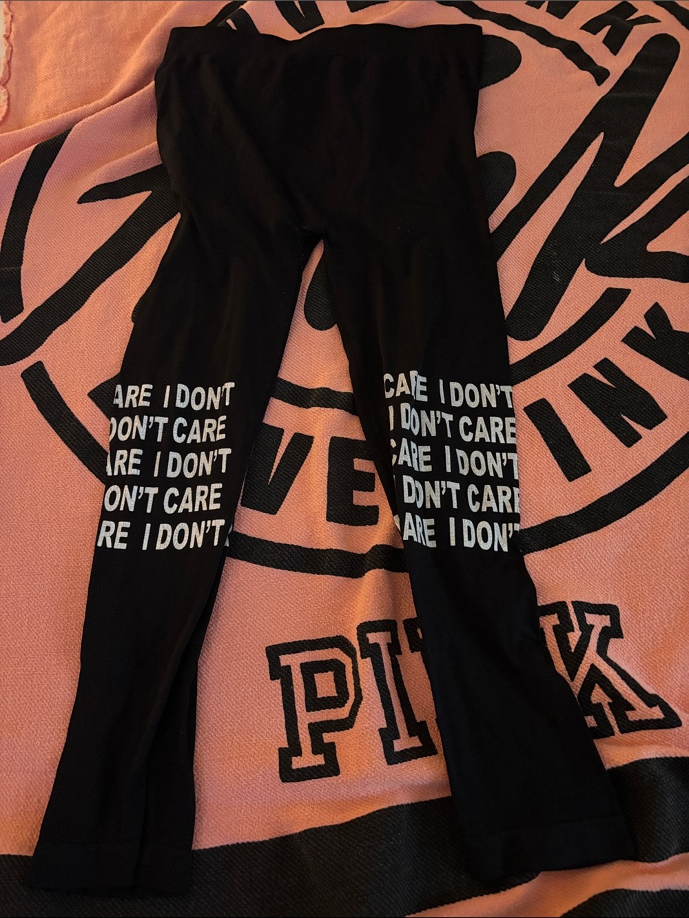feathers Black Leggings with White Repeated 'I DON'T CARE’ Text